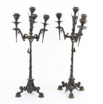 Pair of 19th century French bronze candelabra, each with four lights, the centre on a winged sphinx
