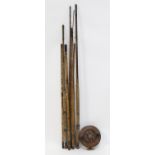 Large timber fishing reel, 20 cm diameter, a three piece hexagonal cane fishing rod, 311 cm long,