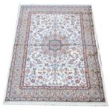 Kashmir rug, with full pile ivory ground and Shahbaz medallion design, 170 x 120 cm