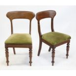 Set of four mid Victorian mahogany dining chairs, with broad top rails over scroll carved mid rails