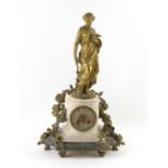 19th century French alabaster and gilt metal mantel clock, the dial surmounted by a figure