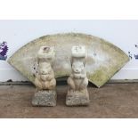 Reconstituted stone curved garden seat with squirrel form supports, H47 W101 cm