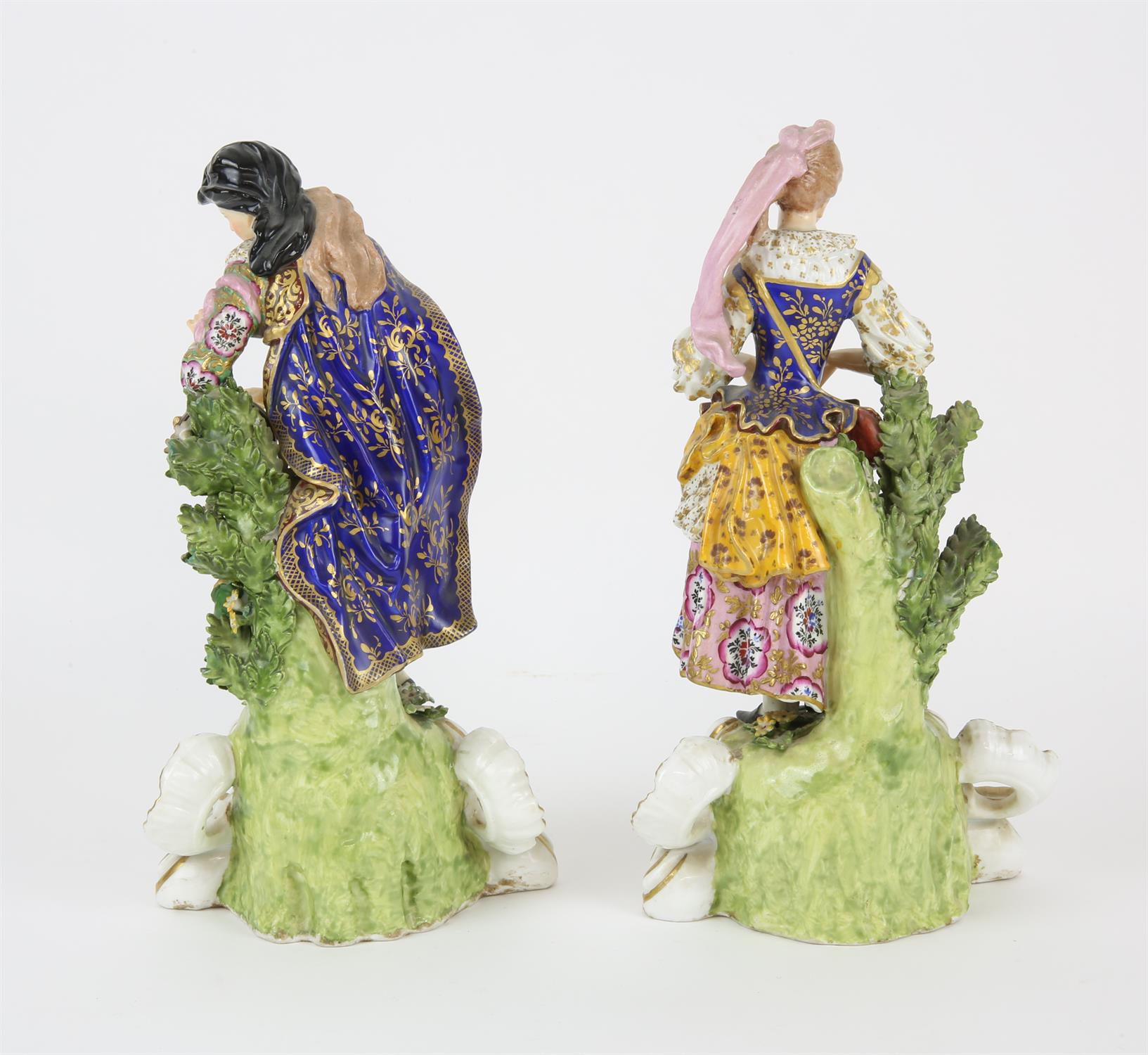 A pair of early 19th century Derby figures as male and female Musicians, brightly decorated in - Image 2 of 3