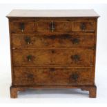 18th century mahogany chest of three short over three long graduated long drawers on bracket feet,