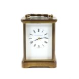 Brass carriage clock by Matthew Norman, of conventional form with enamelled dial,