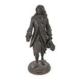 Early 20th century bronze of a gentleman, wearing elaborate frock coat and a plumed hat,