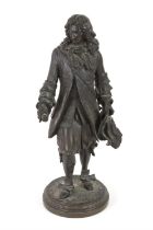 Early 20th century bronze of a gentleman, wearing elaborate frock coat and a plumed hat,