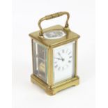 French brass carriage clock, by Henri Jacot, in obis case,striking on a gong, 16cm high overall,