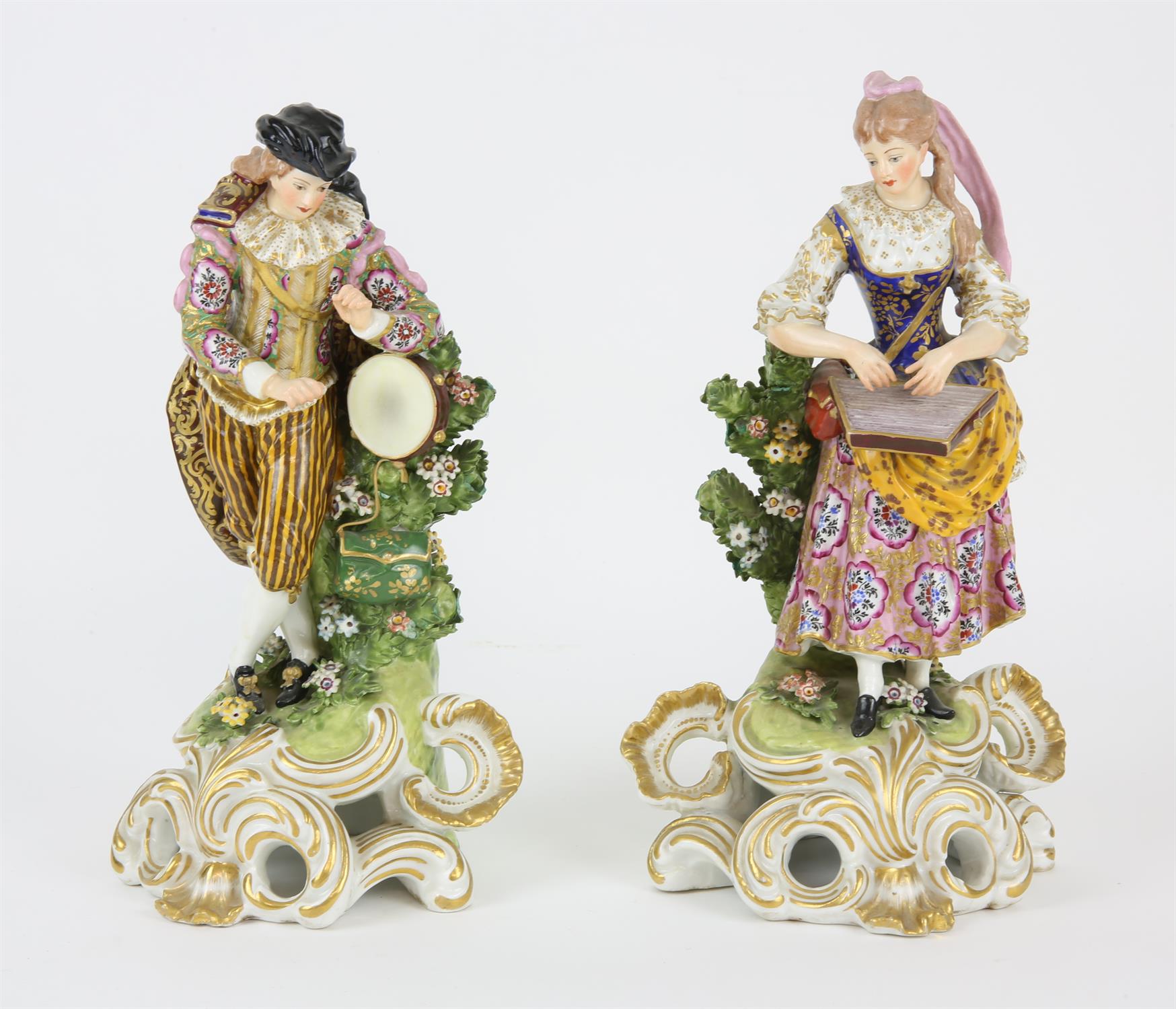 A pair of early 19th century Derby figures as male and female Musicians, brightly decorated in