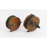Two walnut and brass mounted sea fishing reels, 4.5" and 5"