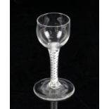 18th century cotton twist drinking glass on round foot, 13cm high,