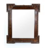 19th century walnut wall mirror, with protruding corners, egg and dart moulding and rectangular