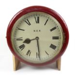 North Eastern Railway maroon painted wall clock, the Roman dial marked N.E.R. R20,