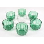 Six 19th century green glass bowls with faceted decoration, and similar clear glass bowl, 9cm high,