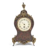 19th century French boulle work mantel clock timepiece, the flame finial over a waisted case with