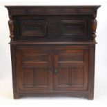 18th century and later panelled oak court cupboard, the upper section with two chip carved doors