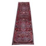 Persian runner, with full pile terracotta ground and bespoke floral design, 278 x 72 cm