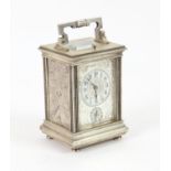 Repeating Carriage clock striking on a gong with alarm movement, in white metal case heavily