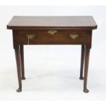 19th century oak fold-over tea table, the rectangular top hinged to reveal a frieze compartment on