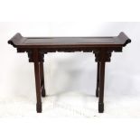 A Chinese hardwood altar table, with scroll ends over square scroll carved frieze and square legs
