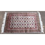 Persian Kashan carpet, central floral medallion and scrolling floral design within corresponding