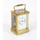 French brass carriage clock with lever movement, the white enamelled dial with Roman numerals,