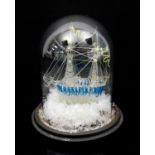 Late 19th century glass model frigger of a ship, under glass dome, dome 18cm high,