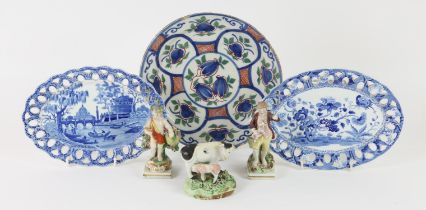 Early 19th century Staffordshire group of a cow with calf, figure of a boy with dog,