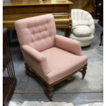 Late 19th century pink upholstered armchair, on turned legs with cross stretcher and castors