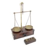 19th century mahogany and brass apothecary scales, the base with single drawer and various weights