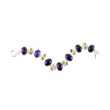 Amethyst and peridot bracelet, seven oval cabochon cut amethysts, measuring an average 13.5 x 9.