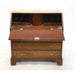 George III mahogany bureau, the sloping fall enclosing a fitted interior over four long graduated