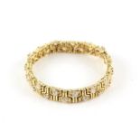 Diamond bracelet, set with thirty round brilliant cut diamonds mounted on fancy textured gold links,