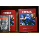 Various books on horror films, including duplicate copies of the Aurum Film Encyclopedia of Horror.