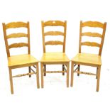 Set of seven oak ladderback chairs, with solid seats and square legs joined by turned stretchers (7)