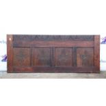 Oak four panelled board, the panels carved with a quatrefoil, over a later lunette carved base,