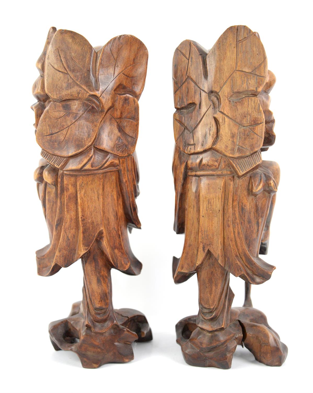 A pair of Taoist Chinese wooden sculptures representing  The immortal Li Tieguai.  34 cm High - Image 2 of 2