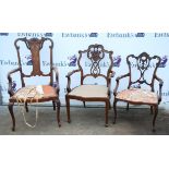 Pair of early 20th century carved open armchairs, another similar, an inlaid open armchair,