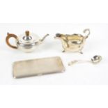 Silver miniature teapot, London 1921, 9 cm high, silver sauce boat and ladle and an engine turned