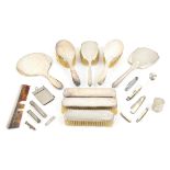 Art Deco silver backed hand mirror and two brushes, together with an mirror and various brushes,