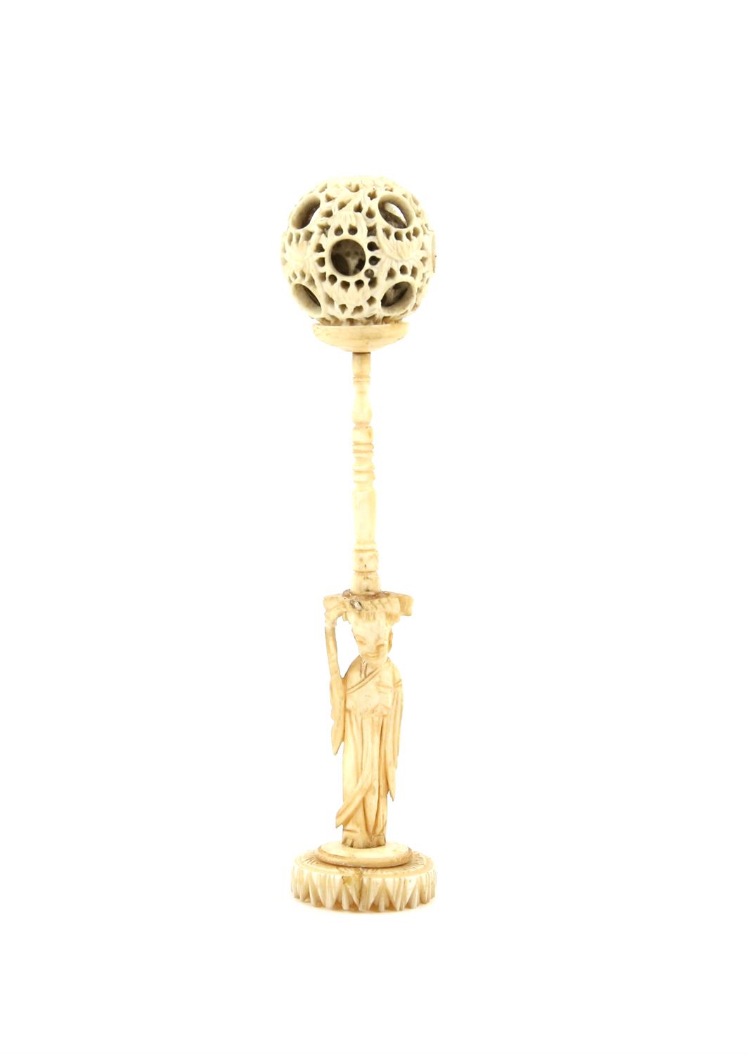 A Chinese Devil's work ball on stand  Carved bone with a puzzle ball and a stand with  a lady : 14.