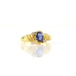 Sapphire and diamond ring, central oval cut sapphire weighing 0.80 carats, with a round brilliant