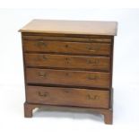 Early 19th century mahogany chest of drawers, with brush slide over four long graduated drawers and