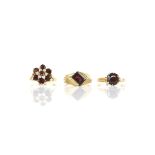 Three garnet rings, including, a garnet and pearl cluster ring, in 9 ct gold, size M,