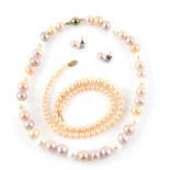 Two pearl strands and pearl earrings, peach, white and pink cultured pearl strand,