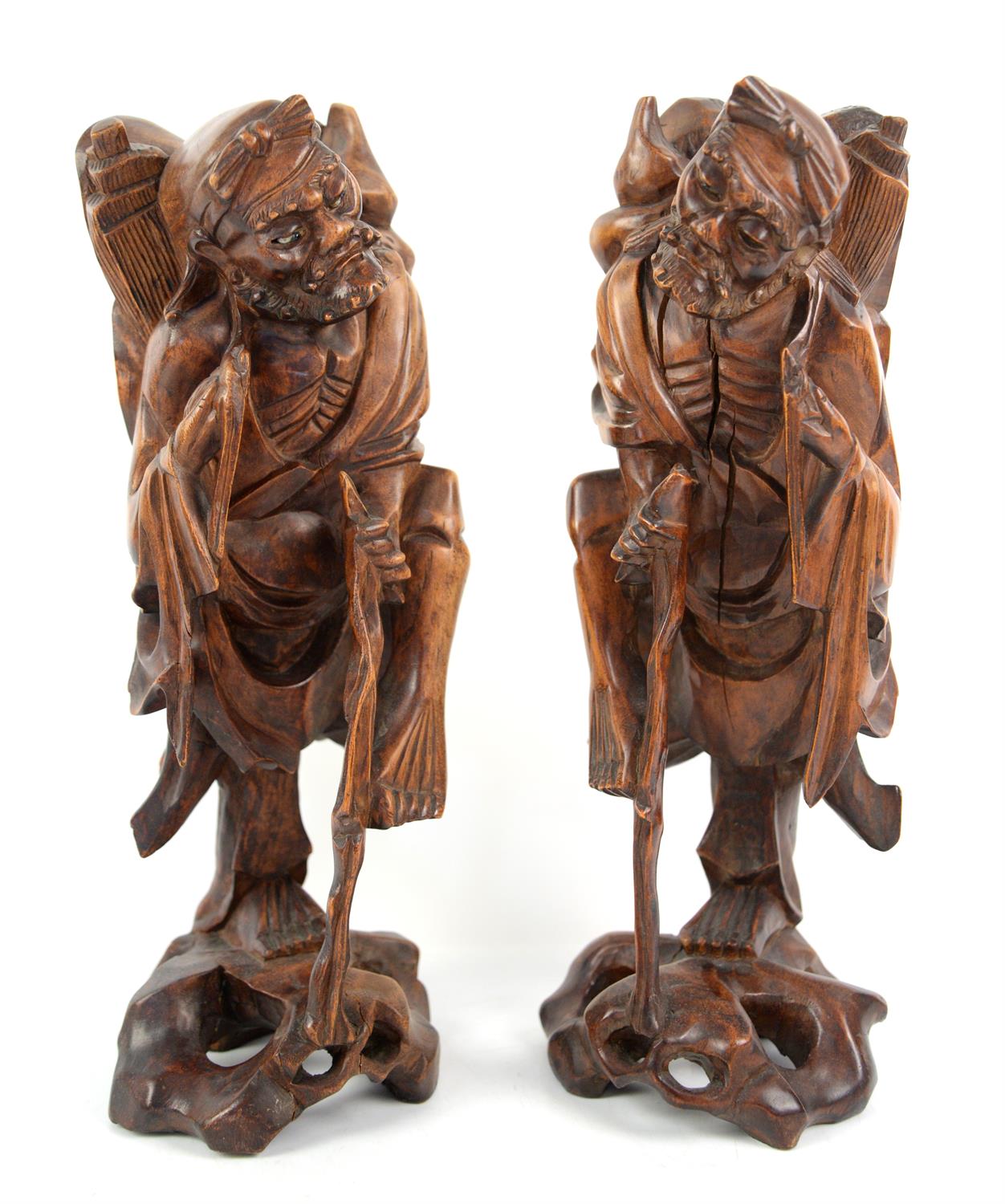 A pair of Taoist Chinese wooden sculptures representing  The immortal Li Tieguai.  34 cm High