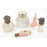 Silver topped glass inkwell, London 1888, silver topped perfume atomiser, another atomiser and two