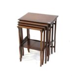 Early 20th century mahogany and chequerbanded nest of four tables, with square cabriole form legs,