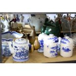 Graduated set of three Oriental blue and white jars and covers, largest 19 cm high,