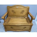 A CARVED BEECH HALL SEAT WITH STORAGE (SEAT NEEDS ATTENTION) 100 X 87 X 54CM